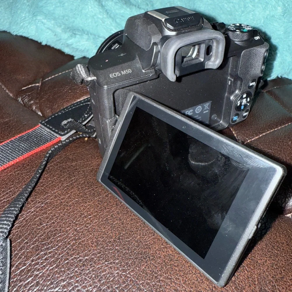 Canon Black DSLR Camera with Strap